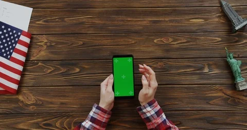 View from the top on the woman's hands scrolling and taping on the vertical Stock Footage 91728681