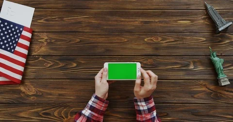 View from the top on the woman's hands scrolling and taping on the horizontal Stock Footage 91730145
