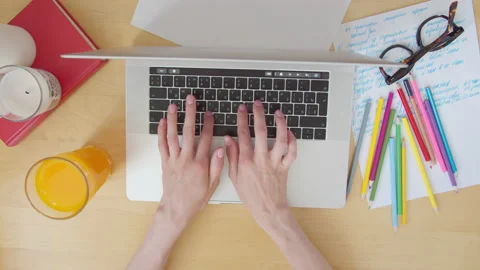 View from top women's hands typing on laptop keyboard on Desk  Stock-Footage 134355372