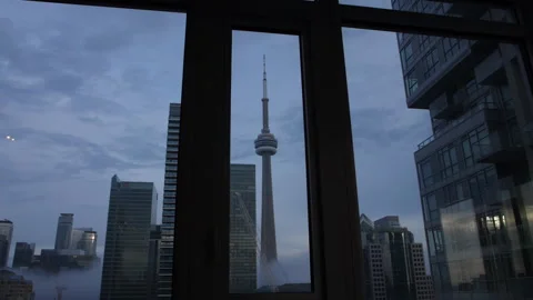 View of the Toronto CN Tower looking through an apartment window Stock-Footage 255199027