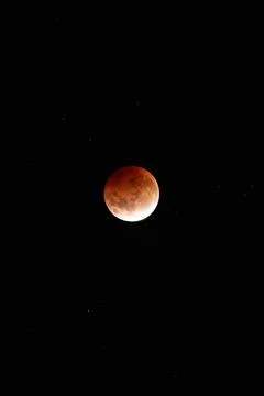 View of the total lunar eclipse in the night sky Stock Photos