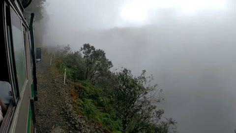 View from tourist bus going on edge of narrow Death Road, Bolivia 스톡 동영상 169454174