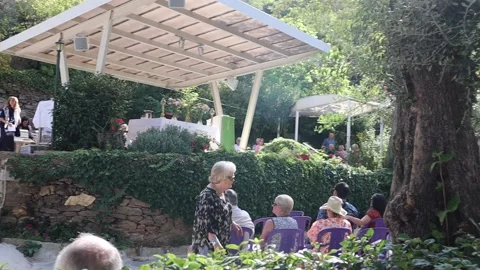 View tourists waiting for mass at The ancient House of Virgin Mary  in Ephesu Video stock 222000578