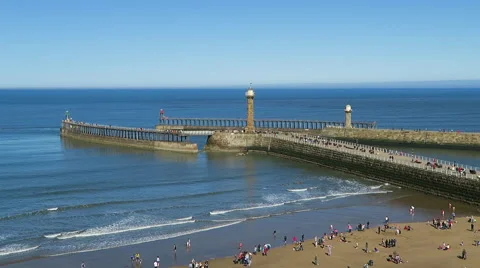 View of tourists on Whitby beach Stock Footage 49292173