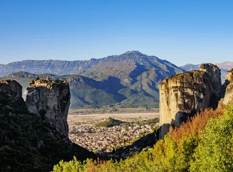 View towards the Monastery of the Holy Trinity and Kalabaka at sunrise, Meteora, Stock Photos