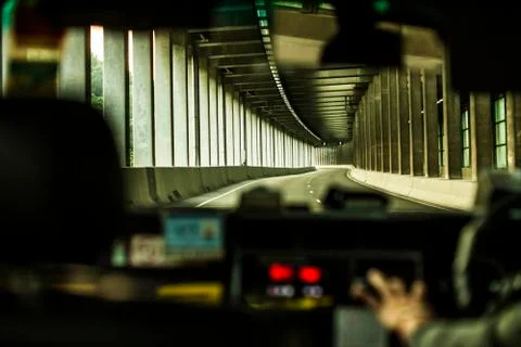 View towards road from inside an Uber car Stock Photos