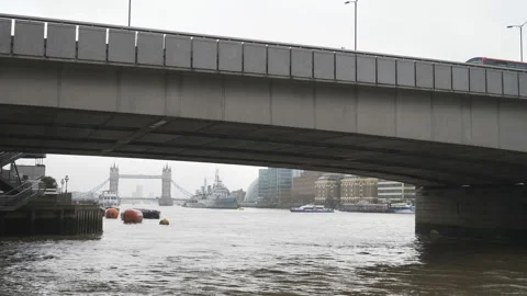 A view of the Tower Bridge underneath a bridge in a fog. Stock Footage 120488259