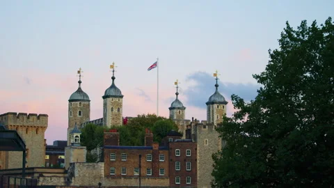 A view of the Tower of London with its turrets and the Union Jack flag Stock Footage 321271753