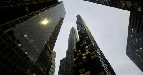 View of towering skyscrapers under a cloudy sky in an urban area Illustrazione stock