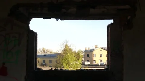View On A Town Outside Through A Blasted-out Window Stock Footage 130896729