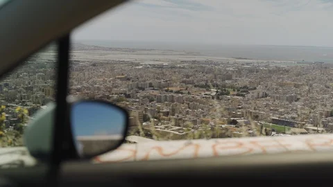 View of town through car window on top of mountain in Trapani, Sicily Stock Footage 114504983
