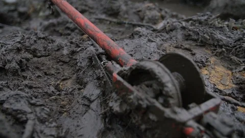 View of track jack lay down in mud and dirt Stock Footage 77430387
