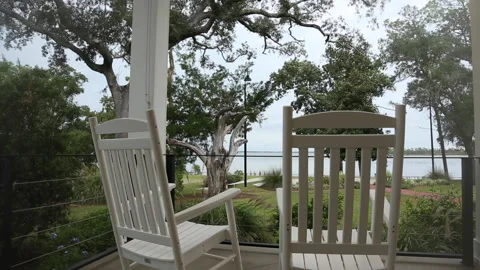 View Tracking Behind White Rocking Chairs On Porch 스톡 동영상 167738807