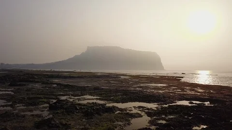 View Tracking Forward Over Shoreline Toward Crater of Sunrise Peak Stock Footage 101274173