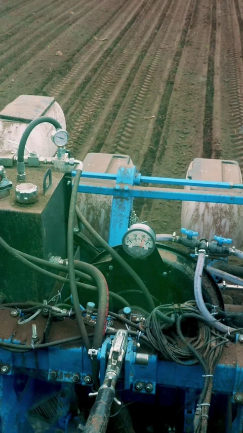 View from tractor cab. Closeup of Tractor seeder, pneumatic sowing machine, Stock Footage 316987733