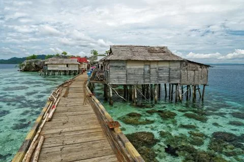 View of traditional bajo village with bridge and wooden houses on the Togean  Stock Photos