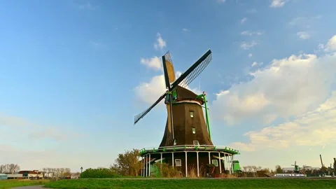 View of a traditional Dutch windmill under a blue sky, Netherlands. 스톡 동영상 334997496