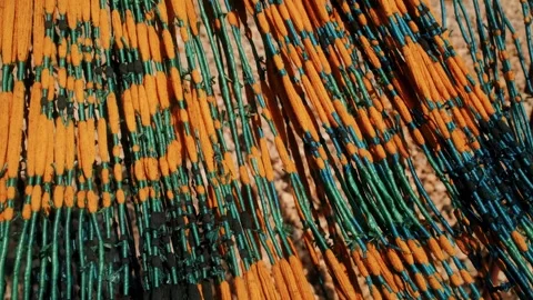 View of traditional ikat weaving threads in Waingapu, Indonesia. Video stock 343685490