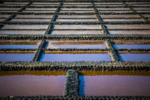 View on traditional rectangular salt evaporation ponds or salt pans creatin.. Stock Photos