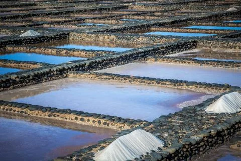 View on traditional rectangular salt evaporation ponds or salt pans creatin.. Stock Photos
