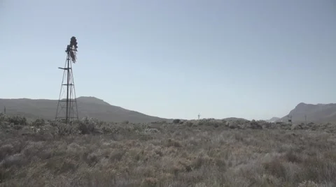 View of traditional windmill in grassland Stock Footage 65964161