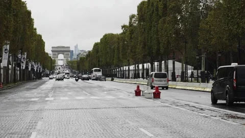 View of Traffic on the Champs-Elysees with Arc de Triomphe in the background Stock Footage 148527342