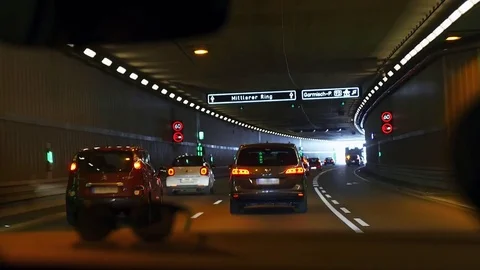 View of traffic flow driving through illuminated tunnel. Stock Footage 82009862