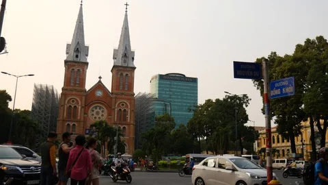 View on traffic in front of the Notre-Dame Cathedral in Ho Chi Minh City Stock Footage 106786722