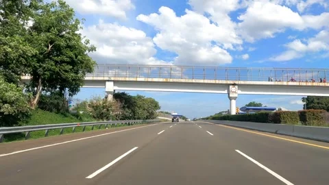 View of traffic on the highway during a clear sky. Driving POV. Stock Footage 262281285