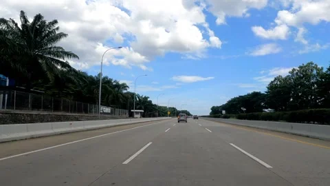 View of traffic on the highway during a clear sky. Driving POV. Stock Footage 262281343