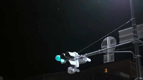 View to traffic light at street intersection in night time Stock Footage 279214098