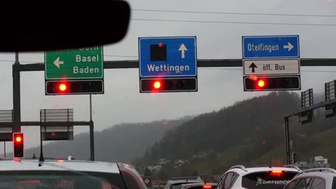 View of traffic lights with regulatory signs through windshield. Video stock 80958283