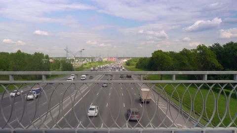 Up view of traffic on Moscow ring highway from the bridge above it. Cloudy sky Stock Footage 133792285