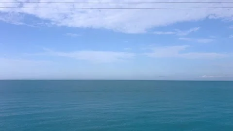 View from traffic window. Movement along sea and bright sky, minimalism. By trai Stock Footage 221249964