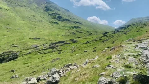 View of the trail up to Helvellyn from Grassmere on a summers day Stock Footage 157679762