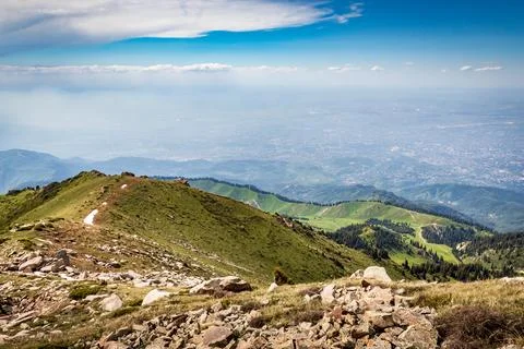 View from the trail to Kumbel Peak to Three Brothers Peak, Kok Zhailau and the Stock Photos