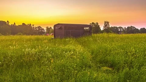 View of a trailer in a field at sunset in Riga, Latvia. Stock-Footage 341454496