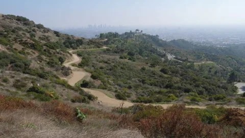View of trails in Griffith Park including Griffith Observatory and Los Angeles. Stock Footage 261587244