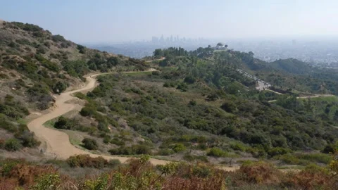 View of trails in Griffith Park including Griffith Observatory and Los Angeles. Stock Footage 261587290