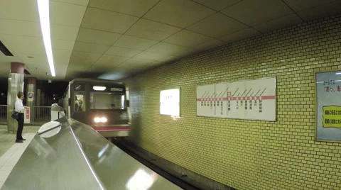 View of a train arriving at the Nihombashi Subway Station in Osaka, Japan Stock Footage 44612843