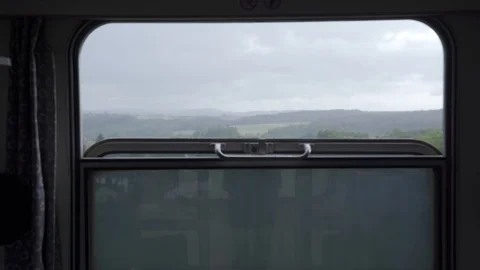 View from the train compartment window to the passing landscape Stock Footage 115766293