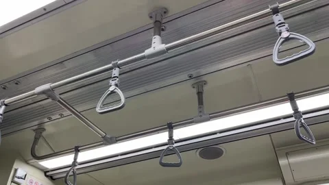 View of train interior, selective focus of handles for passengers Vidéo 236810161