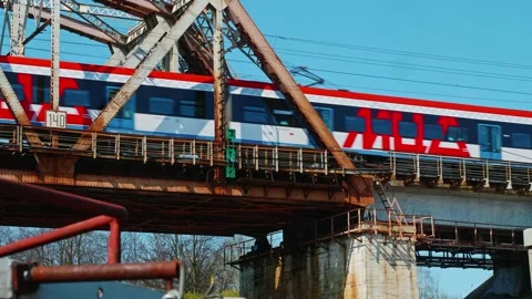 View of train moving on bridge and following Moscow central diameter. Low angle Stock Footage 153994887