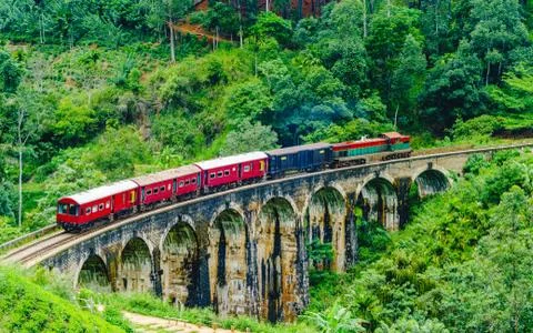 View on Train passing over Nine Arches Bridge in Ella, Sri Lanka Stock Photos