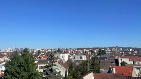 View from the train passing in suburban area with a bright blue sky and Stock Footage 150118535
