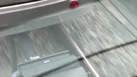 View of Train Rails and Train Wagon Coupling connector while train is moving Stock Footage 215485785