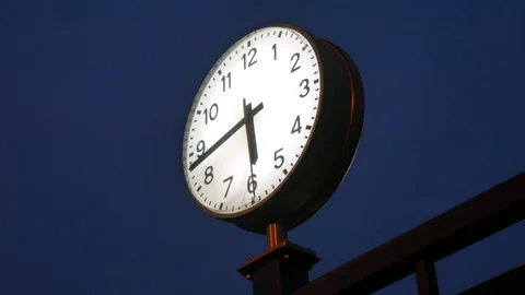 View on a train station clock at night as the seconds are passing. Stock Footage 105700643