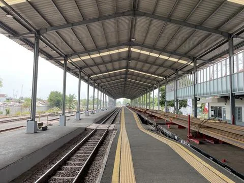 View on the train track and platform at the station Stock Photos