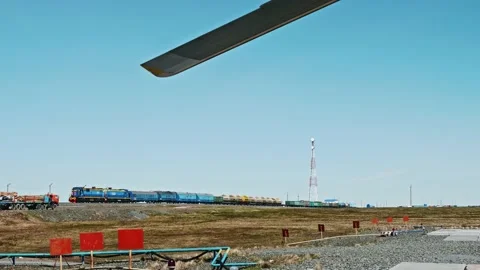 View of train which transport fuel from landing platform. Russian Tundra Stock Footage 165692910