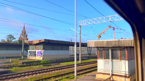 View from train window arriving on Riga Central Train Station on sunny morning Video stock 249244067